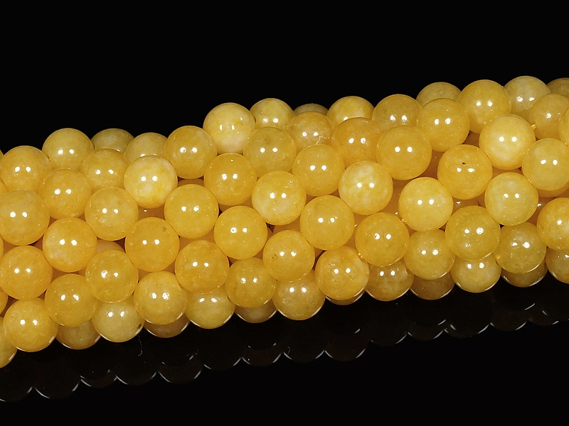 Бусины желтого кальцита (тонированный кварц). Диаметр отверстия - 1 мм. Размеры, вес, длина и количество бусин на нити указаны примерно.
