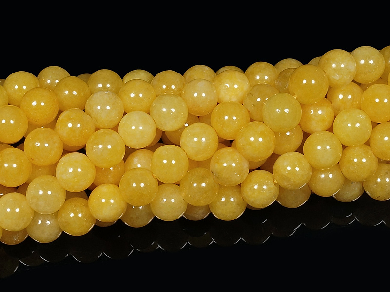 Бусины желтого кальцита (тонированный кварц). Диаметр отверстия - 1.3 мм. Размеры, длина и количество бусин на нити указаны примерно.
