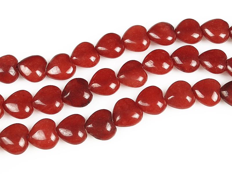 Бусины сердечки красного агата (тонированный кварц). Диаметр отверстия 1 мм. Размеры, вес, длина и количество бусин на нити указаны примерно. Микровыемки.
