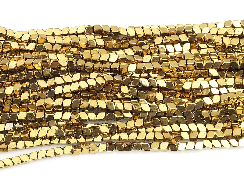 Бусины гематита многогранники золото (гематин). Диаметр отверстия 0.5 мм. Размеры вес, длина и количество бусин  на нити указаны примерно.
