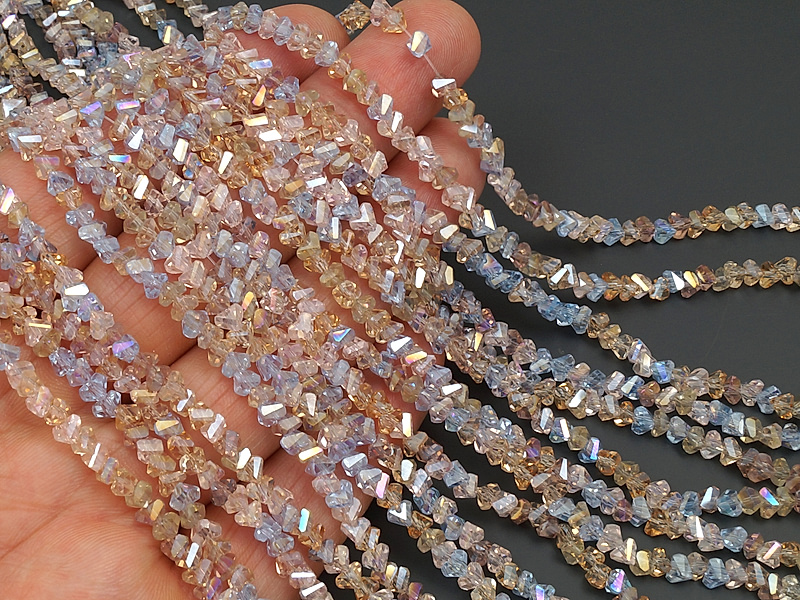 Граненые стеклянные бусины, алмазная крошка треугольник микс желтый, сиреневый с напылением для создания бижутерии (украшений). Диаметр отверстия - 1.1 мм. Размеры, вес, длина и количество бусин на нити указаны примерно. Точнее замеряем по требованию.
 | Интернет-магазин товаров для рукоделия