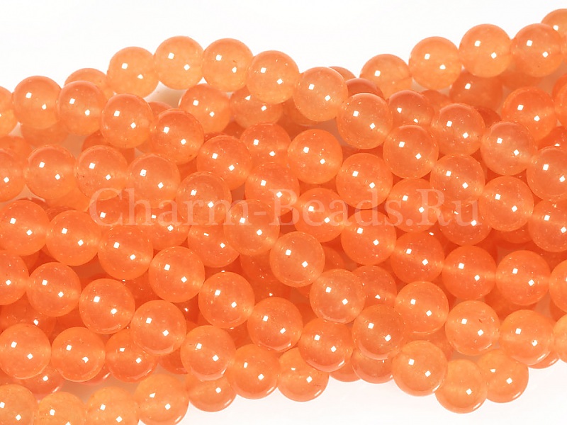 Бусины оранжевого кальцита (тонированный кварц). Диаметр отверстия 1 мм. Размеры, вес, длина и количество бусин на нити указаны примерно.

