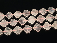 Бусины розового кварца в форме клевера. Диаметр отверстия 1 мм. Есть выемки, шероховатости, видно на фото.
