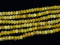 Граненые бусины желтого опала рондель. Диаметр отверстия 0.8 мм.  Размеры, вес, длина и количество бусин на нити указаны примерно.
