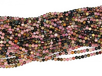 Граненые бусины турмалина эльбаита (цветного турмалина), каменный бисер. Диаметр отверстия 0.6 мм. Размеры, вес, длина и количество бусин на нити указаны примерно.
